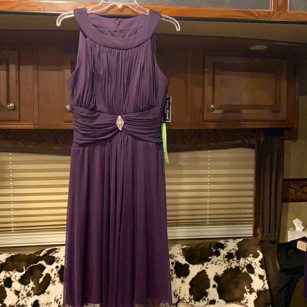 Circle neck evening dress.  Mid length.